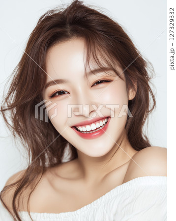 Radiant young woman with a captivating smile and natural beauty in a minimalist setting Radiant young woman with a captivating smile and natural beauty in a minimalist setting 127329332