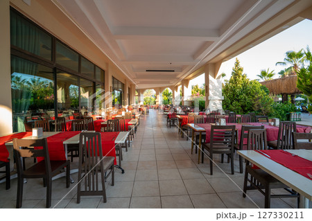 Outdoor terrace of an empty cafe and restaurant. 127330211
