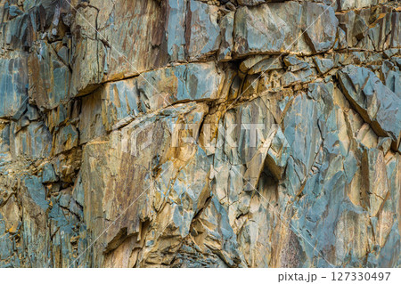 Full-frame background and texture of vertical sedimentary cliff 127330497