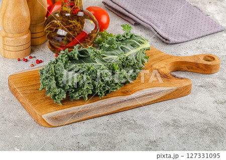 Green Kale cabbage leaves ocer board Green Kale cabbage leaves ocer board 127331095