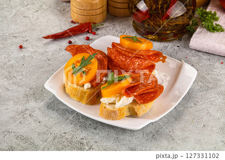 Bruschetta with sausage and tomato 127331102