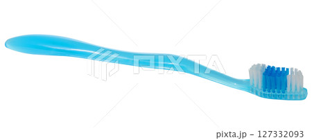 Blue toothbrush with white and blue bristles. Oral hygiene item on isolated background. Blue toothbrush with white and blue bristles. Oral hygiene item on isolated background. 127332093