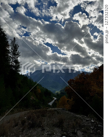 Mountainous road sky. Cloudy road landscape. High quality photo Mountainous road sky. Cloudy road landscape. High quality photo 127332320
