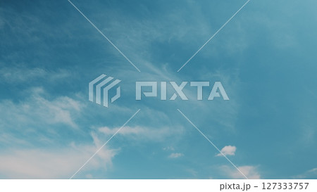 Time lapse. A Beautiful Clear Sky Displaying Wispy Clouds in a Peaceful Atmosphere Perfect for Daydreaming 127333757