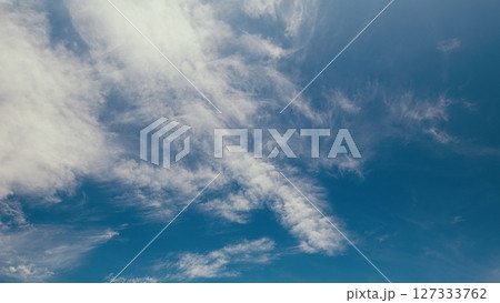 Time lapse. Beautiful and Majestic Cloud Patterns Gracefully Adorning a Clear Bright Blue Sky Time lapse. Beautiful and Majestic Cloud Patterns Gracefully Adorning a Clear Bright Blue Sky 127333762