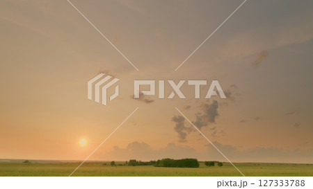 Time lapse. A Serene Sunrise Unfolds Over a Beautifully Tranquil Landscape, Capturing Peaceful Moments Time lapse. A Serene Sunrise Unfolds Over a Beautifully Tranquil Landscape, Capturing Peaceful Moments 127333788