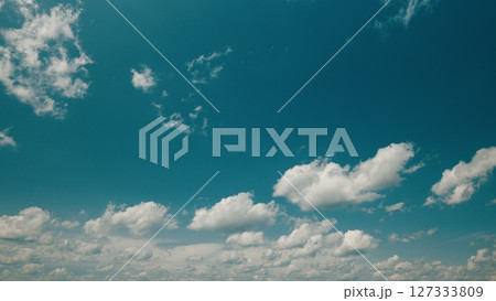 Time lapse. A Beautiful Serene Blue Sky Filled with Fluffy White Clouds An Absolutely Perfect Day 127333809