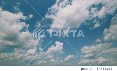 Time lapse. A Beautiful and Dreamy Cloudy Sky with a Stunning Blue Background Filling the Horizon 127333831