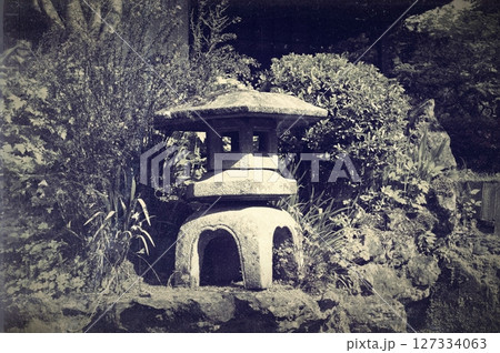 Traditional lantern made of stone in Japanese garden. Black and white photography 127334063