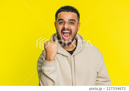 Happy Indian man celebrating success, winning, birthday, lottery jackpot goal achievement, good news Happy Indian man celebrating success, winning, birthday, lottery jackpot goal achievement, good news 127334672