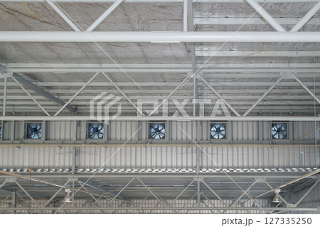 Overhead crane or lifting equipment inside factory or warehouse. 127335250