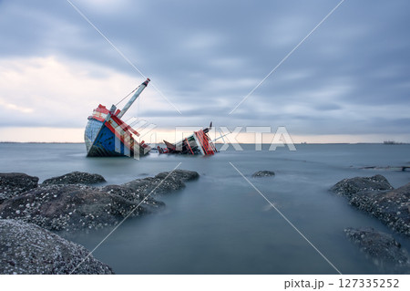 Old wrecked fishing boat on coast of Ang Sila Village, Saensuk Sub-district, Chonburi Province of thailand. Old wrecked fishing boat on coast of Ang Sila Village, Saensuk Sub-district, Chonburi Province of thailand. 127335252