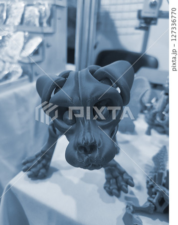Dog skeleton head printed on 3D printer from molten plastic. Creative multicolored models printed on 3D printer. Concept 3D Printing technology. New modern 3D Printing additive technology. Blue color 127336770
