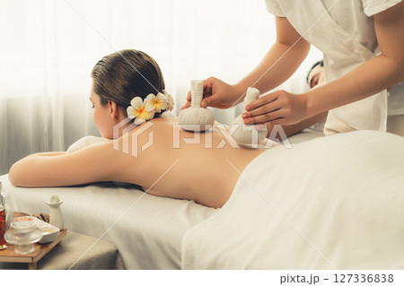 Hot herbal ball spa massage body treatment at day spa . Quiescent Hot herbal ball spa massage body treatment at day spa . Quiescent 127336838