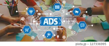 Creative teamwork session focused on advertising strategies, digital marketing tools, brainstorming concepts with colorful notes and hands collaborating. Amity 127336995