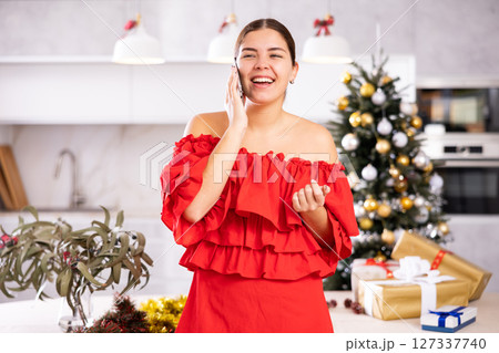 Talking on phone, girl shares plans for New Year 127337740