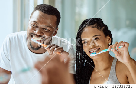 Black couple, toothbrush and dental wellness in bathroom together for grooming, beauty hygiene and healthcare. African man, woman and happy oral care or brushing teeth for healthy morning routine 127338726