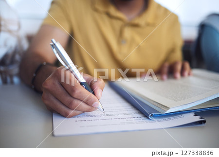 Student exam, college test and hand of man writing question paper in classroom for education, book research and knowledge for scholarship registration. Person at university to study, learn and write Student exam, college test and hand of man writing question paper in classroom for education, book research and knowledge for scholarship registration. Person at university to study, learn and write 127338836