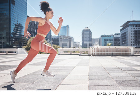 Fitness, city and woman running for exercise, health and wellness. Sports runner, energy and female athlete exercising, cardio or training workout outdoors on street for race, marathon or endurance. Fitness, city and woman running for exercise, health and wellness. Sports runner, energy and female athlete exercising, cardio or training workout outdoors on street for race, marathon or endurance. 127339118