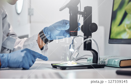 Lab microscope, scientist hands and analysis of bacteria, virus or research for medical solution. Science laboratory, tools and ppe gloves for safety, study and innovation for dna, molecule and focus 127339145
