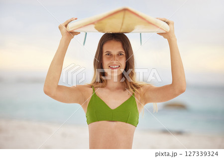 Girl with surfboard, surfing and beach portrait with fitness and adventure outdoor, young surfer and sports in Australia. Surf, exercise and happy in bikini, active lifestyle with travel and ocean 127339324