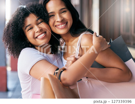 Happy, friends and hug portrait with shopping bag products for boutique purchase fun in New York, USA. Smile, care and appreciation in women friendship with black people enjoying shopping spree. 127339396