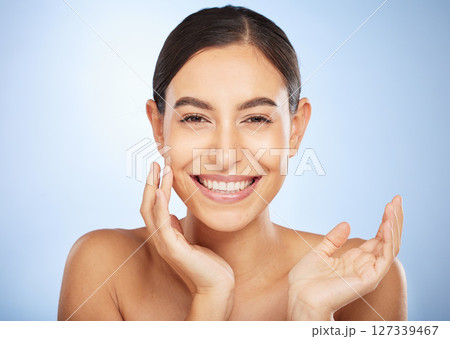 Portrait, skincare and beauty with a model woman in studio on a gray background for natural treatment. Face, wellness and luxury with an attractive young female posing to promote a skin care product Portrait, skincare and beauty with a model woman in studio on a gray background for natural treatment. Face, wellness and luxury with an attractive young female posing to promote a skin care product 127339467