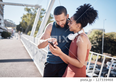 Exercise, fitness and black couple with phone in city for running, marathon training and workout on bridge. Love, sports and man and woman on smartphone for social media, music and health mobile app Exercise, fitness and black couple with phone in city for running, marathon training and workout on bridge. Love, sports and man and woman on smartphone for social media, music and health mobile app 127339468