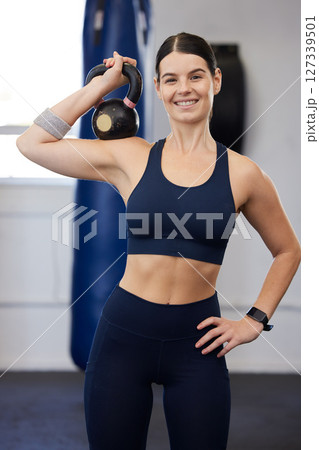 Fitness, kettlebell and woman in gym with exercise portrait, strong and weightlifting and body builder. Body workout, training and body building with muscle and happy athlete, sports motivation. Fitness, kettlebell and woman in gym with exercise portrait, strong and weightlifting and body builder. Body workout, training and body building with muscle and happy athlete, sports motivation. 127339501