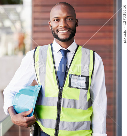 Face portrait, black man and construction architect with all access pass for summit conference. Engineer, architecture and happy male contractor, worker or employee holding safety helmet at workshop Face portrait, black man and construction architect with all access pass for summit conference. Engineer, architecture and happy male contractor, worker or employee holding safety helmet at workshop 127339516