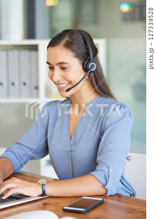 Telemarketing, call center and woman typing on laptop for technical support, crm consulting and help desk communication. Contact us, email and happy customer service worker with pc for online service 127339528