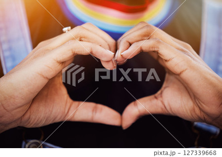 LGBTQ, pride and hands with a heart sign for love, equality and solidarity of a gay woman. Rainbow, freedom and closeup of lesbian female with a hand symbol at a gay pride celebration festival. 127339668
