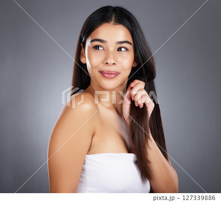 Beauty, hair care or girl model in studio grooming with healthy natural growth products for self love or self care. Studio background, wellness or beautiful woman with pride, confidence or freedom 127339886