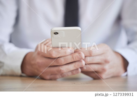 Businessman, hands or phone typing on office schedule, digital marketing calendar or advertising strategy planning. Zoom, worker or employee on communication technology for networking or kpi research Businessman, hands or phone typing on office schedule, digital marketing calendar or advertising strategy planning. Zoom, worker or employee on communication technology for networking or kpi research 127339931