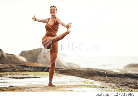 Exercise, woman and stretching on beach, workout and fitness for balance, wellness and health. Female, girl and training on seaside, zen and practice for performance, healthy and energy for power. 127339969
