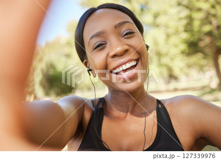Fitness, selfie and black woman in park for workout, exercise and healthy lifestyle with music. Portrait, smile and female athlete taking photograph for social media, sports wellness and video call 127339976