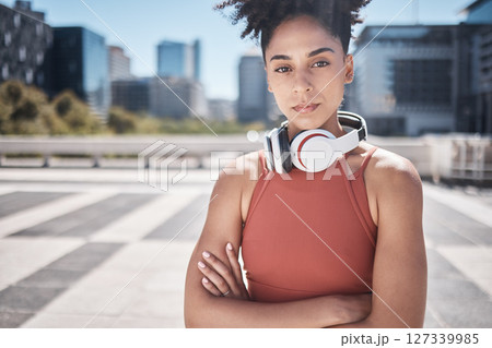 Fitness, headphones and black woman in portrait for workout, exercise or training motivation, mental health and wellness in city. Face of a sports athlete with music audio subscription or technology 127339985