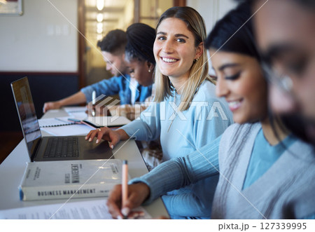 University, education and students in lecture learning and studying business management. College, education scholarship and portrait of happy girl with laptop, books and friends in modern classroom. University, education and students in lecture learning and studying business management. College, education scholarship and portrait of happy girl with laptop, books and friends in modern classroom. 127339995