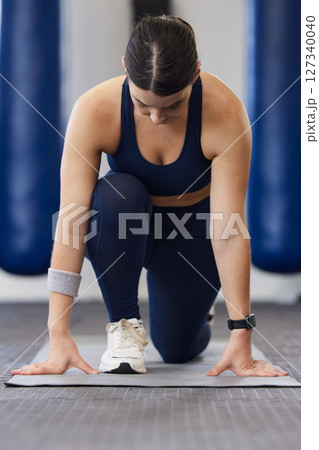 Woman, stretching legs and gym workout for health, self care and development on floor. Girl, fitness and exercise for sport, balance or growth with focus, body goals or training muscle in Toronto Woman, stretching legs and gym workout for health, self care and development on floor. Girl, fitness and exercise for sport, balance or growth with focus, body goals or training muscle in Toronto 127340040