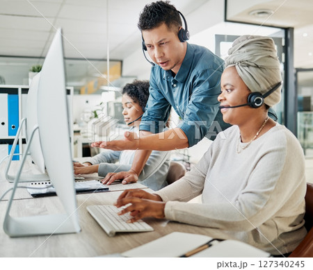 Call center, customer service and manager helping a consultant with an online consultation in the office. Contact us, crm and male telemarketing leader consulting a female agent with a ecommerce sale Call center, customer service and manager helping a consultant with an online consultation in the office. Contact us, crm and male telemarketing leader consulting a female agent with a ecommerce sale 127340245