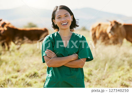 Woman, vet or arms crossed on cow farm, dairy agriculture field or beef produce countryside in wellness goals or vaccine innovation. Portrait, smile or happy animal doctor in bovine cattle healthcare Woman, vet or arms crossed on cow farm, dairy agriculture field or beef produce countryside in wellness goals or vaccine innovation. Portrait, smile or happy animal doctor in bovine cattle healthcare 127340250
