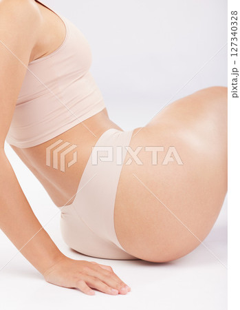 Body, health and woman with beauty and butt, fitness and weightloss with diet motivation, cellulite and skincare against studio background. Liposuction, underwear and skin with wellness and self love 127340328