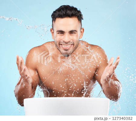 Cleaning, water splash and portrait of man happy with self care routine, facial hygiene and body hygiene wash. Water drop, bathroom skincare hydration and beauty model with health wellness treatment 127340382