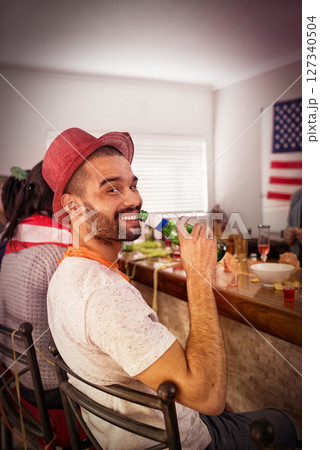 Portrait, man and beer at house party, room and college dormitory in USA for new year celebration, fun and freedom. Happy guy, drinking alcohol bottle and celebrate with social friends in apartment Portrait, man and beer at house party, room and college dormitory in USA for new year celebration, fun and freedom. Happy guy, drinking alcohol bottle and celebrate with social friends in apartment 127340504