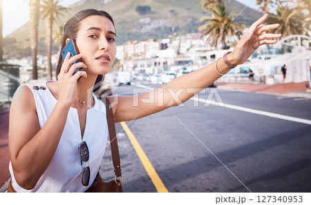 Phone call, taxi or woman on a road in a city for traveling in Miami, Florida on a summer holiday vacation. Stop, bus or girl tourist waiting for a cab car outdoors on city street for an appointment Phone call, taxi or woman on a road in a city for traveling in Miami, Florida on a summer holiday vacation. Stop, bus or girl tourist waiting for a cab car outdoors on city street for an appointment 127340953
