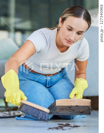 Cleaning, dust and sweeping with woman on floor of living room for housekeeping, hospitality and hygiene. Dirt, messy and trash with girl cleaner and hand broom at home for domestic, maid and tidy Cleaning, dust and sweeping with woman on floor of living room for housekeeping, hospitality and hygiene. Dirt, messy and trash with girl cleaner and hand broom at home for domestic, maid and tidy 127340968