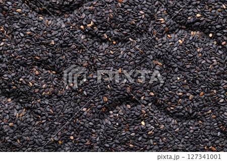 Black sesame seed texture background, Food ingredient 127341001