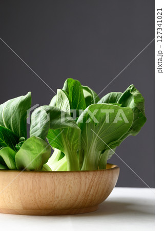 Organic Bok choy or Pak choi in wooden bowl, Fresh vegetable, Food ingredient Organic Bok choy or Pak choi in wooden bowl, Fresh vegetable, Food ingredient 127341021