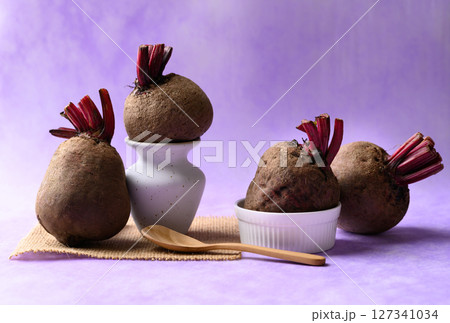 Fresh beetroot on purple background, Imperfectly shape Fresh beetroot on purple background, Imperfectly shape 127341034