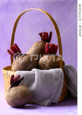 Fresh beetroot in basket on purple background, Organic vegetable 127341036